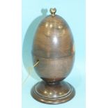 A 19th century turned-wood lignum string box of egg shape, on circular base, the lacquered brass