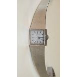 Certina, a ladies 9ct white gold dress watch, the square face with baton numerals, on integral