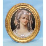 A pair of 19th century reverse-painted portraits of beauties, each with a rose in her hair, 43 x