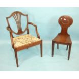 A Victorian mahogany hall chair, the solid back and seat on turned front legs and a Georgian