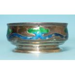 An Art Nouveau silver and enamelled bowl on circular foot, with stylised lily flower decoration,