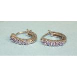 A pair of 14ct white gold small hoop earrings set round-cut tanzanites, 15mm diameter, 2.5g.