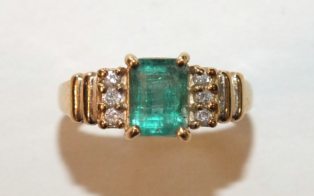 A 9ct gold ring set an emerald and six brilliant-cut diamonds, size P, 3.2g. - Image 2 of 2