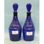 Two 19th century Bristol blue small spirit decanters and stoppers, each with gilded wine label, "