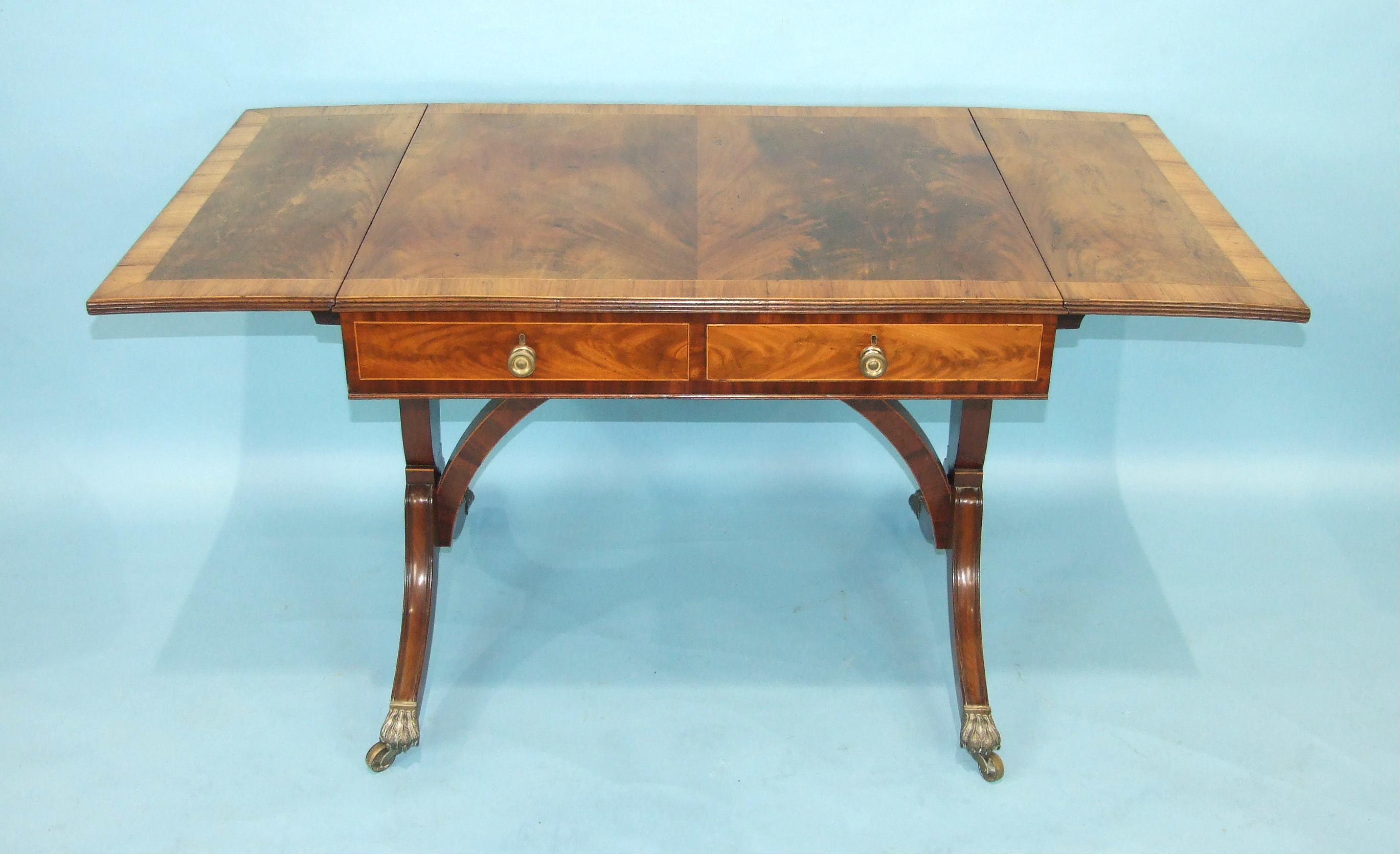 An early-19th century mahogany sofa table, the cross-banded top with two drop leaves above two - Image 3 of 3