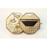 A Victorian Aesthetic Movement brooch in the Japanese taste, in the form of two over-lapping