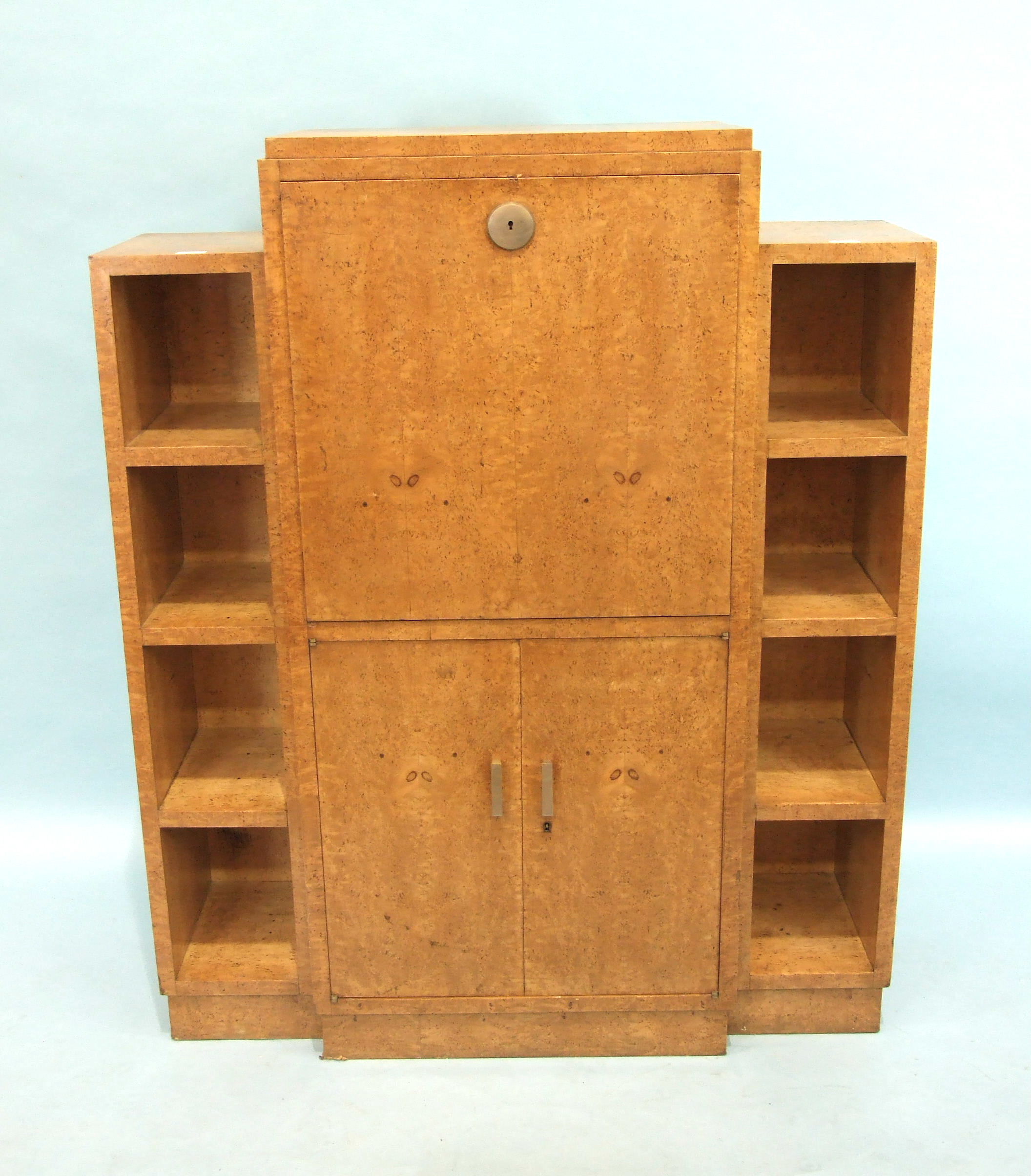 A mid-20th century Continental bird's eye maple combination bookcase and secrétaire à abattant, with