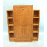 A mid-20th century Continental bird's eye maple combination bookcase and secrétaire à abattant, with