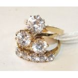 Three 14ct gold rings, all set synthetic white stones, sizes O½ and P, 11.2g, (3).
