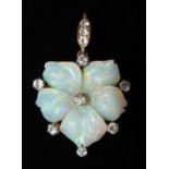 A Late-Victorian opal and diamond pansy pendant with carved opal petals claw-set eight in total