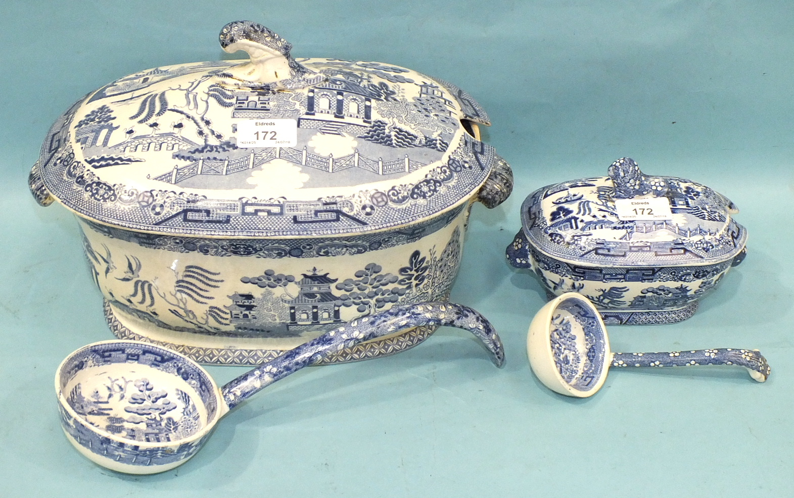 A Victorian blue and white willow pattern tureen, cover and ladle, 34cm wide, 22cm high and a