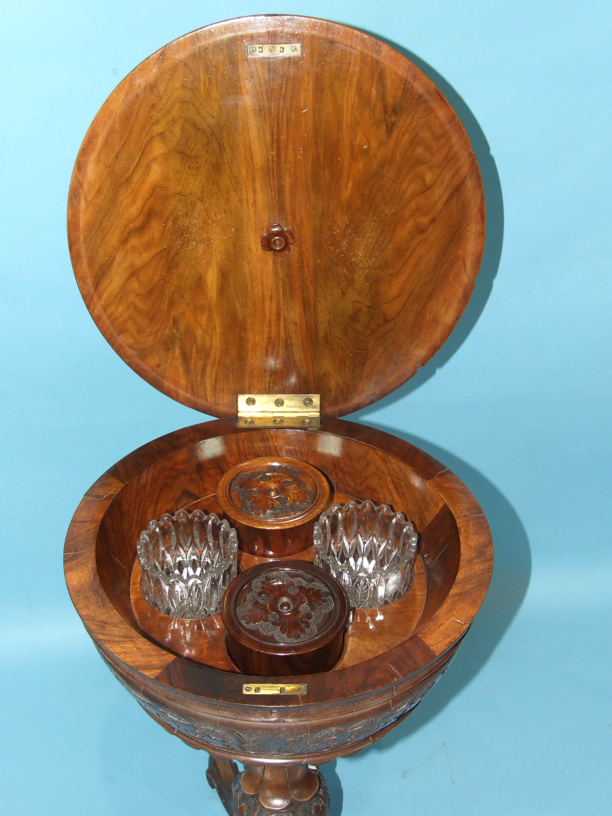 A Victorian carved walnut teapoy, the circular lid revealing two lined canisters and two later - Image 2 of 3