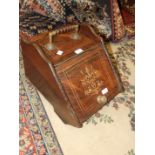 A Victorian inlaid rosewood coal box with brass fittings and shovel.