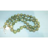 A string of jade coloured hardstone beads with silver clasp.