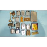 A collection of various cigarette lighters and miscellanea.