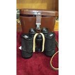 A pair of Carl Zeiss Jena Jenoptem 10x50W binoculars in leather case.