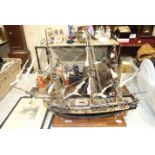 A kit model of HMS Surprise, fully rigged with sails furled, 75cm long, 54cm high and two etchings.
