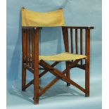 A vintage stained wood folding deck chair/pilot's chair with canvas back and seat. (Belonged to a