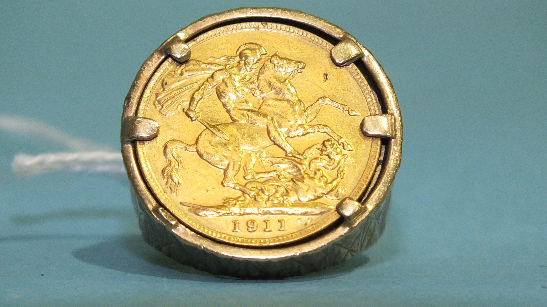 A sovereign ring set a 1911 sovereign, in 9ct gold mount, size O, 20.9g. - Image 2 of 2