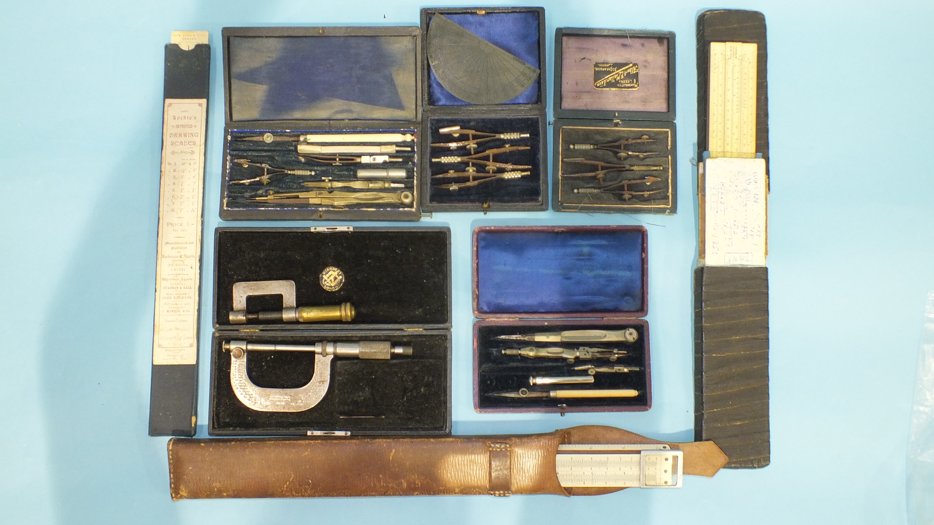 A collection of four geometry part-sets, slide rules, a Brown & Sharp no.46 micrometer and one