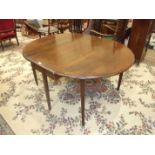 A Georgian mahogany drop leaf dining table with two oval leaves on square tapered legs, 154 x