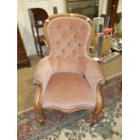 A Victorian mahogany button back salon chair.