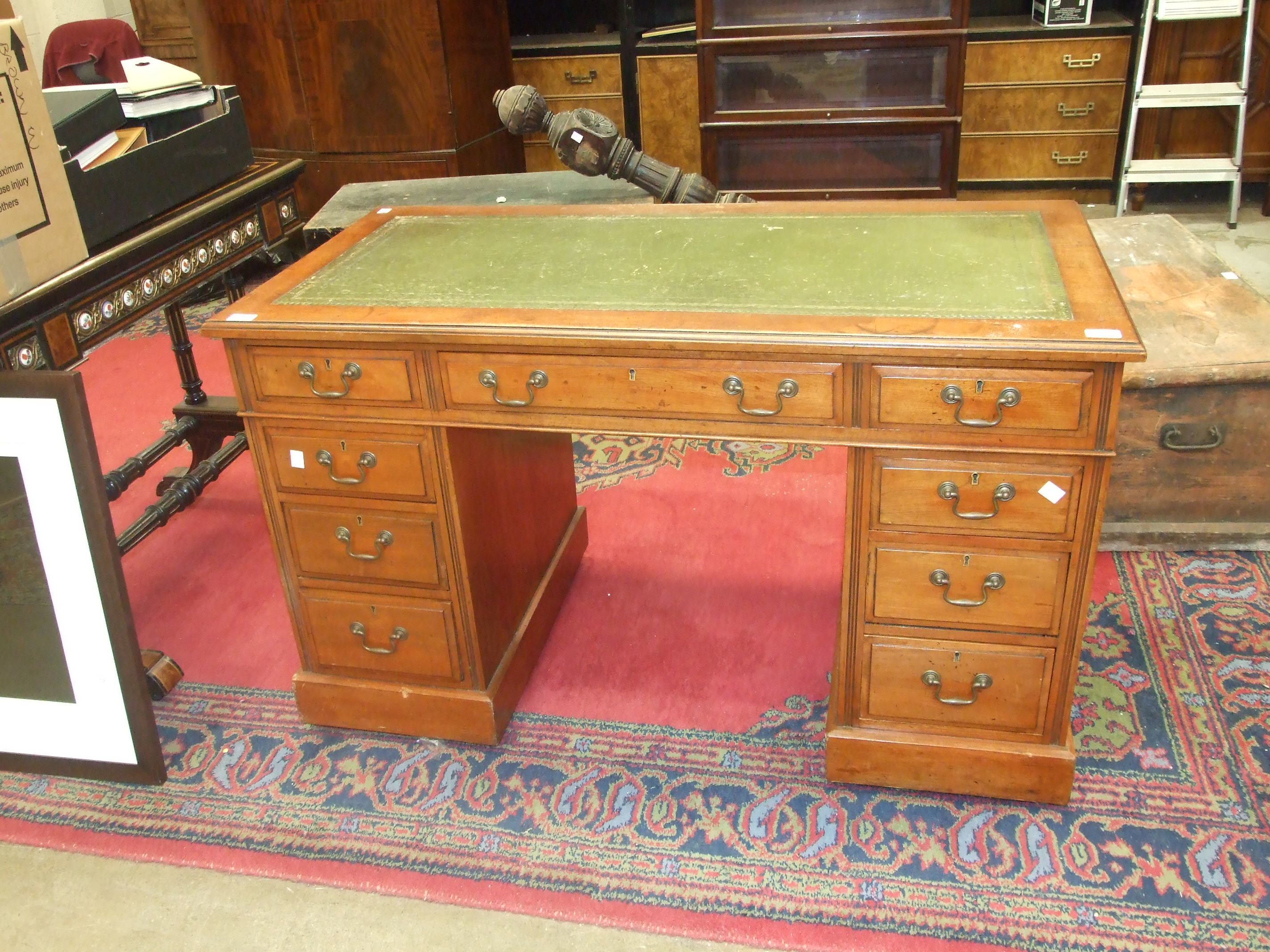 An Edwardian stained mahogany knee-hole desk, the rectangular top with writing inset, and three - Image 2 of 2