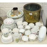 Approximately forty pieces of Portmeirion 'Botanic Garden' tea and dinner ware and a brass