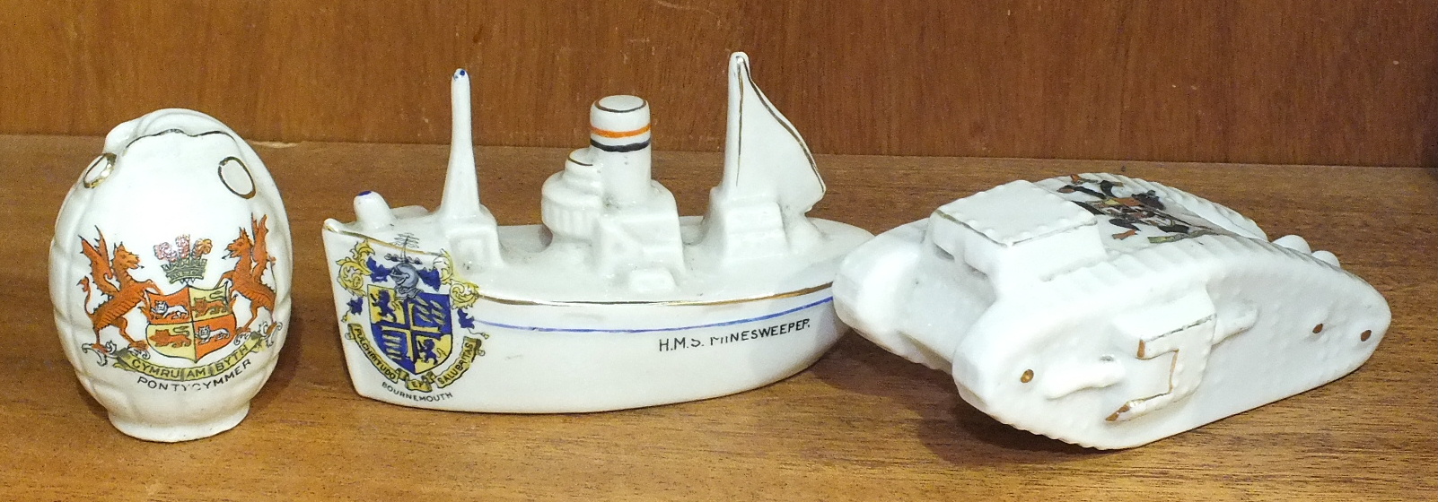 A Carltonware crested model 'HMS Minesweeper', inscribed The Victory of Justice Armistice of the