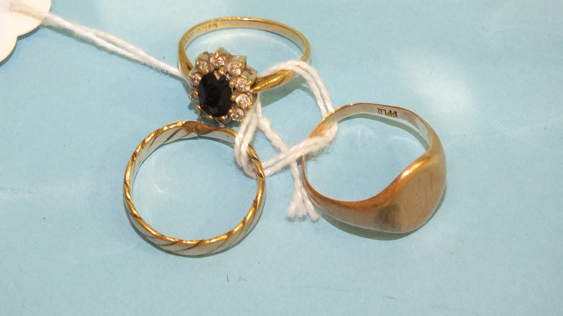 A 9ct gold cluster ring and two other 9ct gold rings, 10.5g, (3).