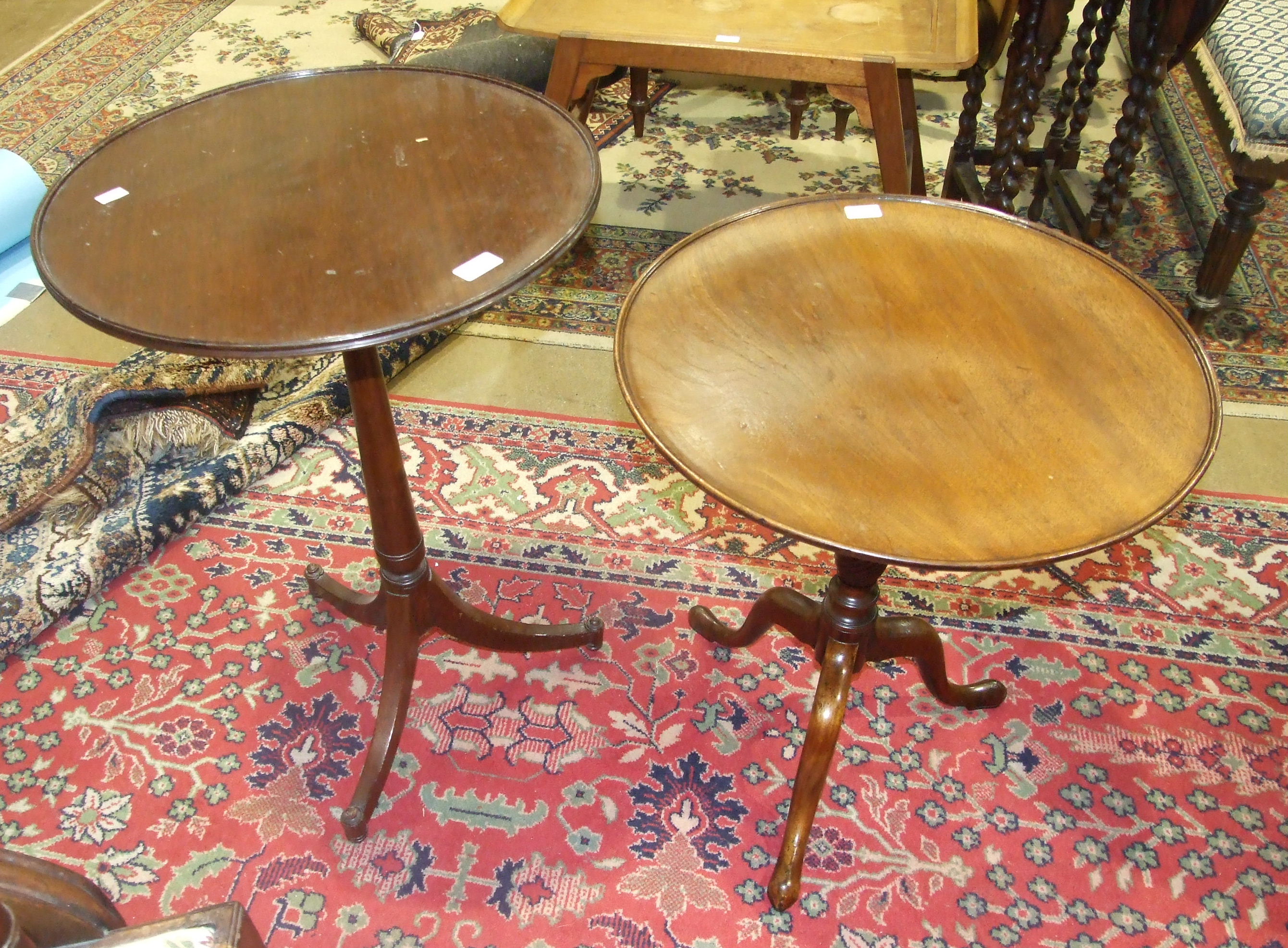 Two mahogany circular occasional tables on tripod supports, 51 and 56cm diameter, (2).