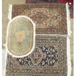 A small silk floral patterned hearth rug, 94 x 63cm, two other oriental rugs and a stained wood high