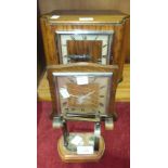 A figured walnut cased mantel clock with square chrome bezel and silver chapter ring, signed