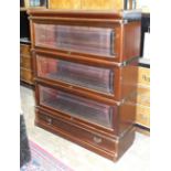 A Globe Wernicke-style three-tier stained mahogany bookcase with base drawer, 86cm wide, 106cm