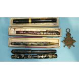 A Conway Stewart fountain pen in case, three others, a pencil and a 1914-1915 Star, (4).