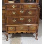 An 18th century walnut chest of two short and two long feather-banded drawers, on associated base