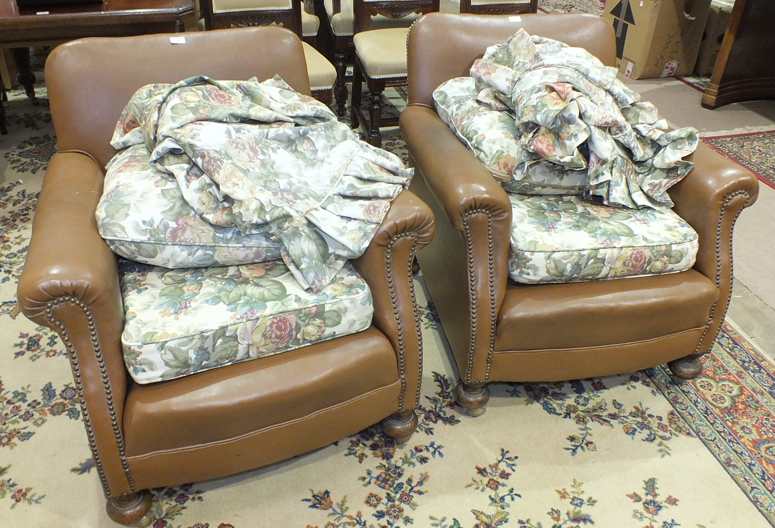A pair of 1930's armchairs with leatherette covers and loose cushions, (2).