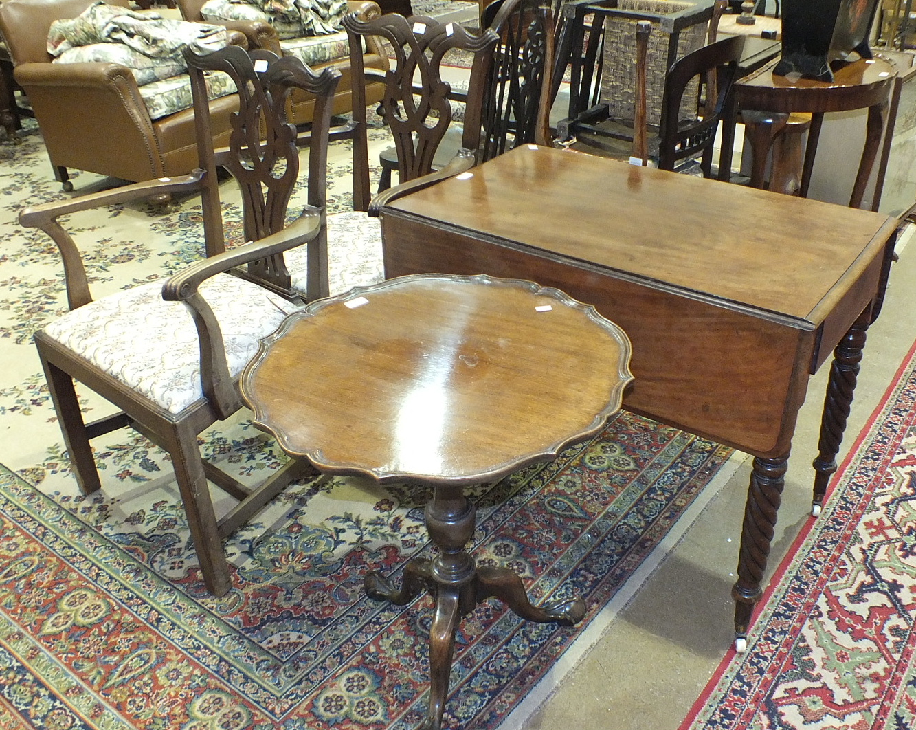 A pair of mahogany Chippendale-style carver chairs, a mahogany tripod table and a mahogany