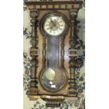 A Walnut cased Vienna style wall clock, 100cm high.