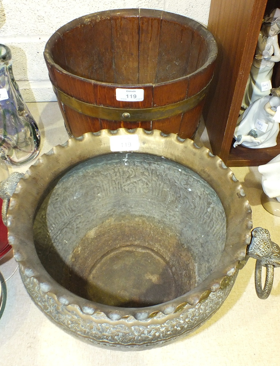 A brass bound coopered oak planter, 28cm diameter, 25cm high and an embossed brass two-handled