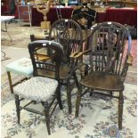 A pair of oak wheel-back carver chairs, various stools, two occasional tables and other small