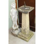 A bronzed sun dial on reconstituted stone base and a concrete figure of a young boy, 85cm high, (