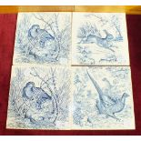 Four Wedgwood Etruria blue and white tiles depicting a pheasant (1), a hare (1) and a woodcock (