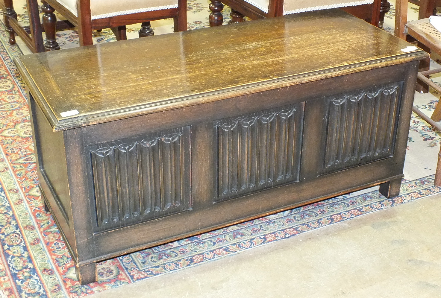 An oak blanket box with linen-fold decoration, 105cm wide.