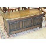 An oak blanket box with linen-fold decoration, 105cm wide.