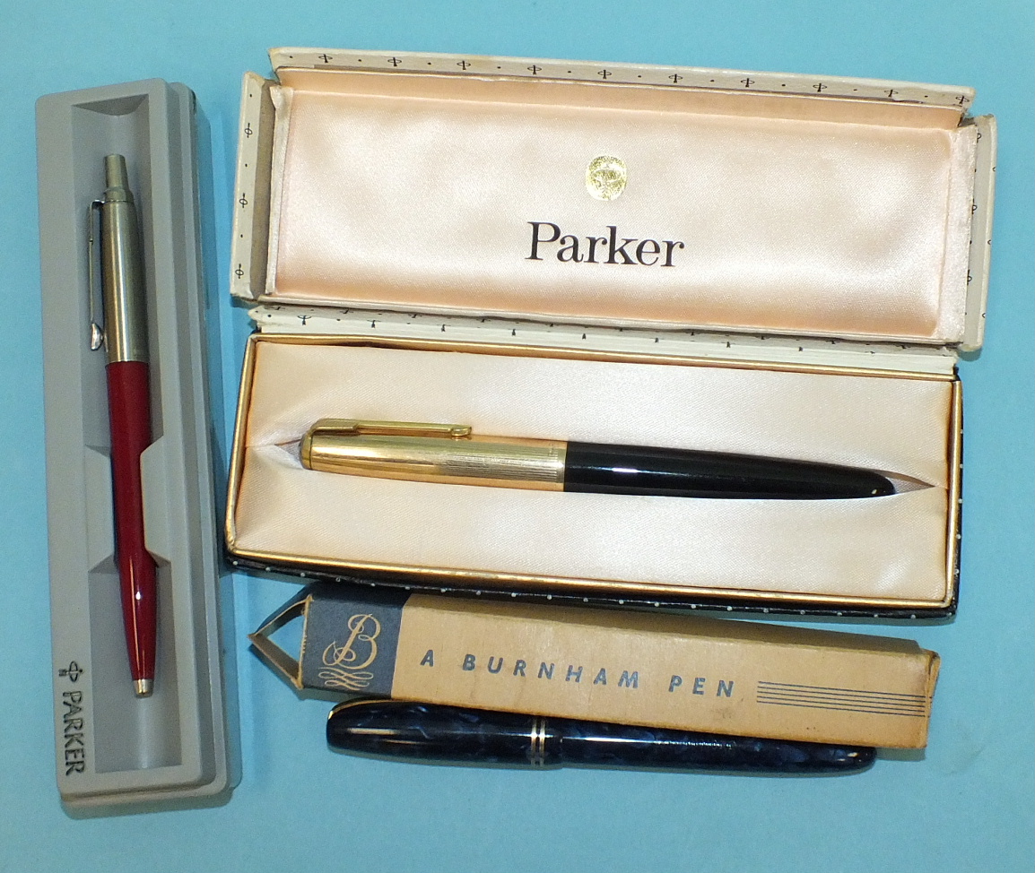 A Burnham No.56 blue 'marble' fountain pen, boxed and two boxed Parker pens, (3).