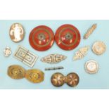 A pair of Victorian embossed silver brooches, two other similar brooches, a garnet bar brooch and