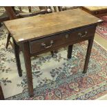 An antique oak side table having a single frieze drawer, on square chamfered legs, 90cm wide.