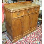 A small oak sideboard, the rectangular top above three drawers and a pair of cupboard doors, 94cm