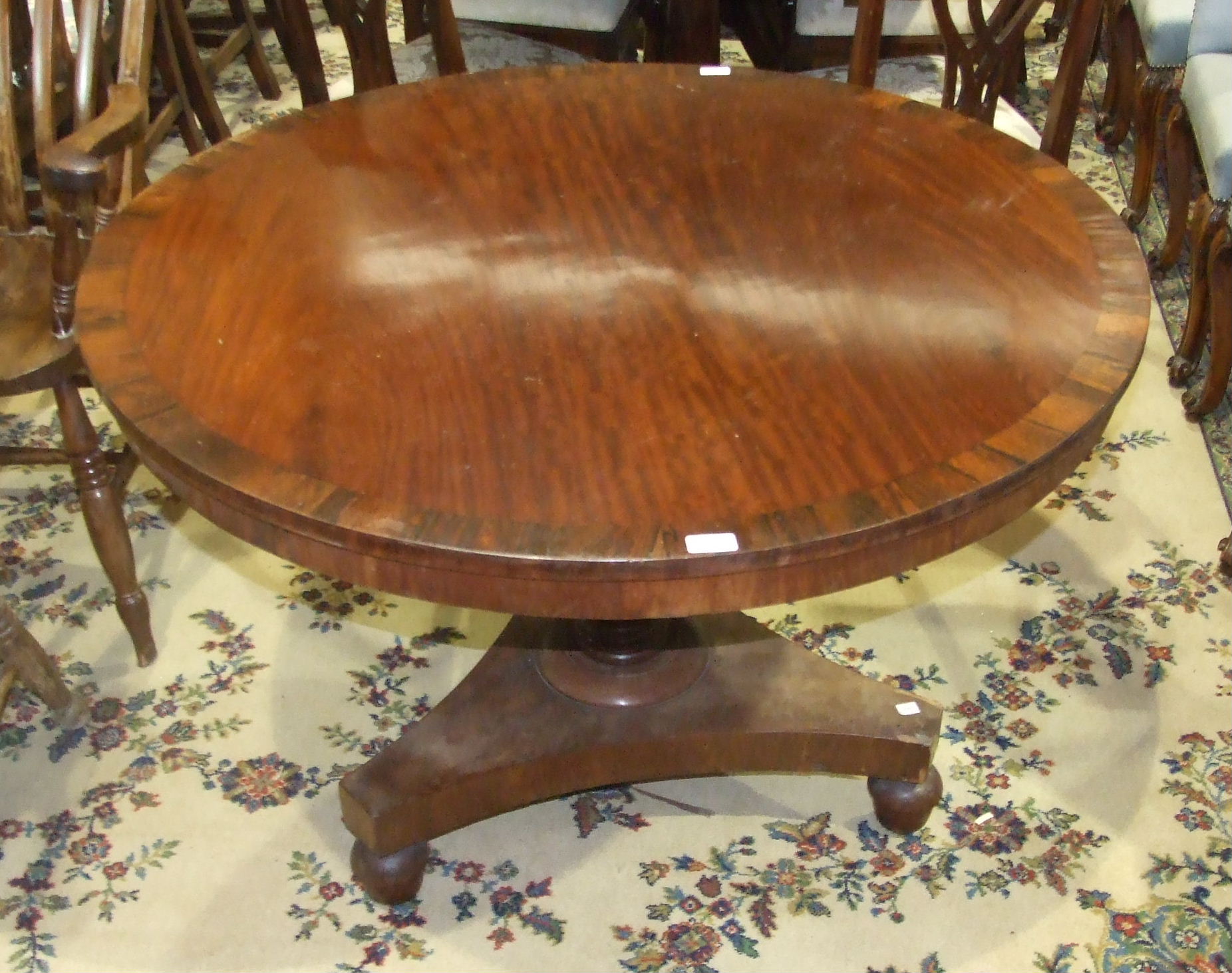 An early-19th century circular mahogany and rosewood-banded breakfast table raised on turned - Image 2 of 2